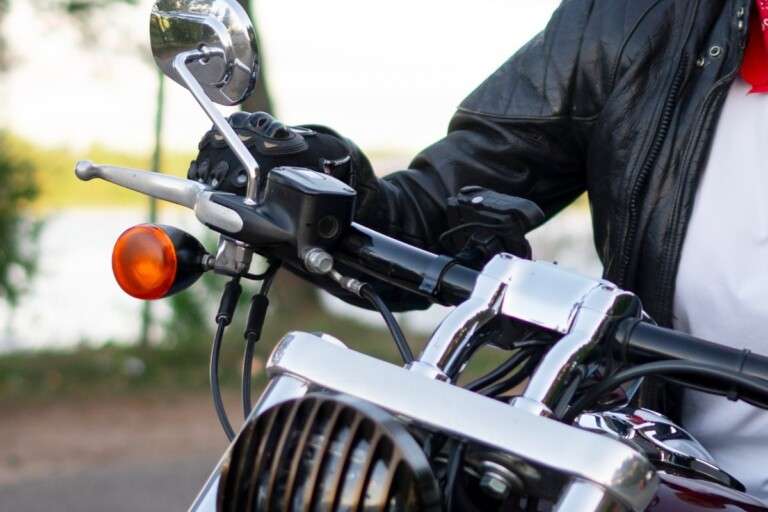 full-shot-senior-woman-with-motorcycle.03db00