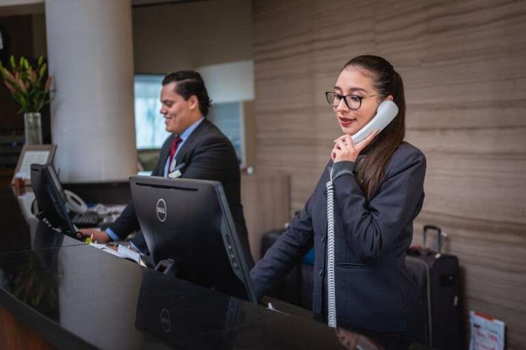 receptionists-phone-call-hotel-reception-woman-man-work-atte-5975962