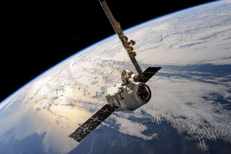 a-satellite-glides-over-earth-showcasing-dramatic-cloud-form-586056